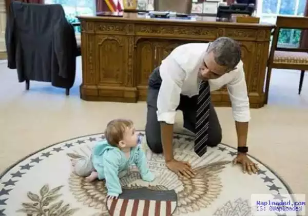 Cool president! Obama competes in a crawling race with an adorable baby